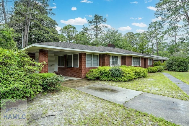 153 Drennon Dr, Jesup, GA 31545 - single story home featuring driveway, brick siding, and a front yard