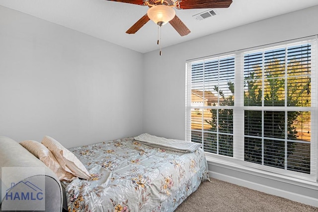 carpeted bedroom with ceiling fan