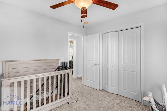 bedroom with ceiling fan and a closet