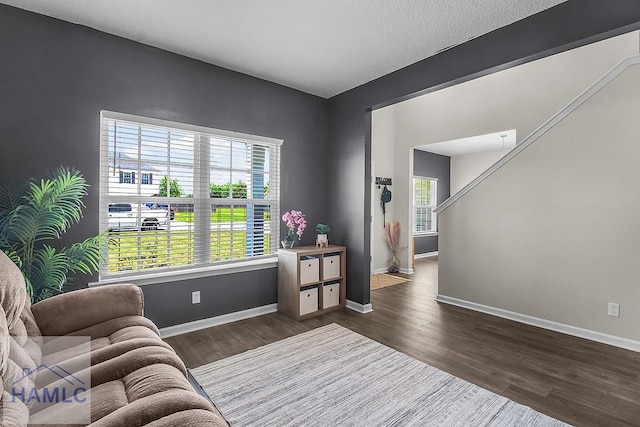 26 Sunflower Cir, Ludowici, GA 31316 - sitting room featuring dark wood-style floors and baseboards