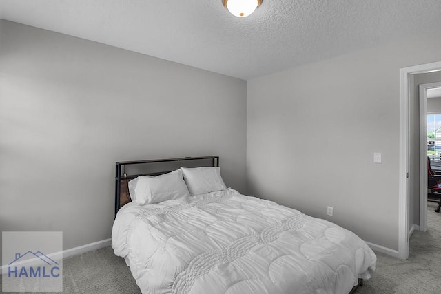 26 Sunflower Cir, Ludowici, GA 31316 - carpeted bedroom with baseboards and a textured ceiling