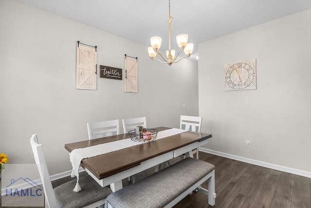 26 Sunflower Cir, Ludowici, GA 31316 - dining space featuring dark wood-type flooring, a chandelier, and baseboards