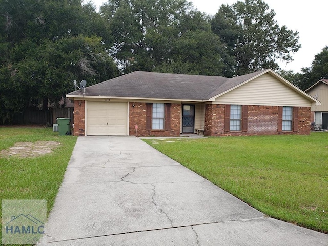 single story home featuring a garage and a front lawn