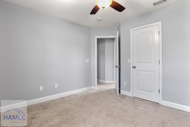 42 Kinlock Ct, Midway, GA 31320 - unfurnished bedroom with carpet floors, ceiling fan, and a textured ceiling