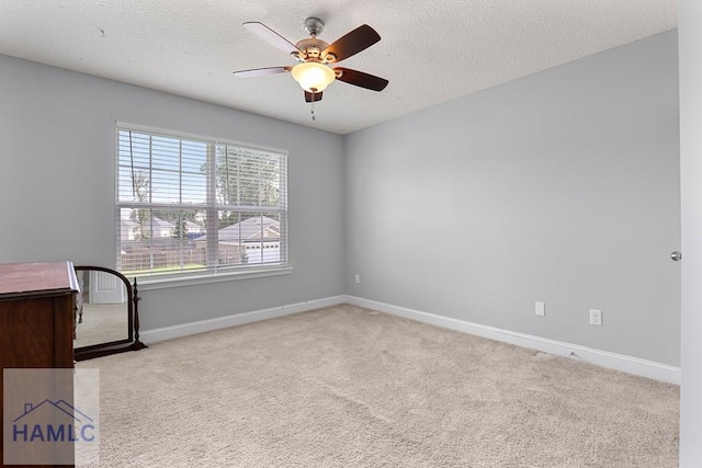 42 Kinlock Ct, Midway, GA 31320 - spare room featuring carpet, a ceiling fan, and a textured ceiling