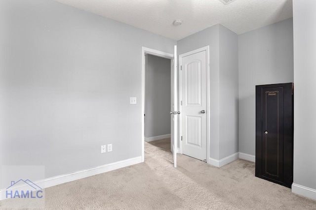 42 Kinlock Ct, Midway, GA 31320 - unfurnished bedroom with carpet and a textured ceiling