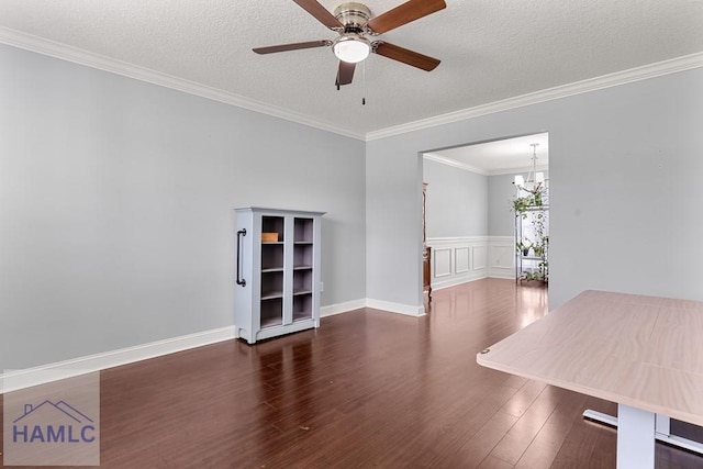 42 Kinlock Ct, Midway, GA 31320 - spare room featuring wood finished floors, a textured ceiling, a ceiling fan, crown molding, and a chandelier