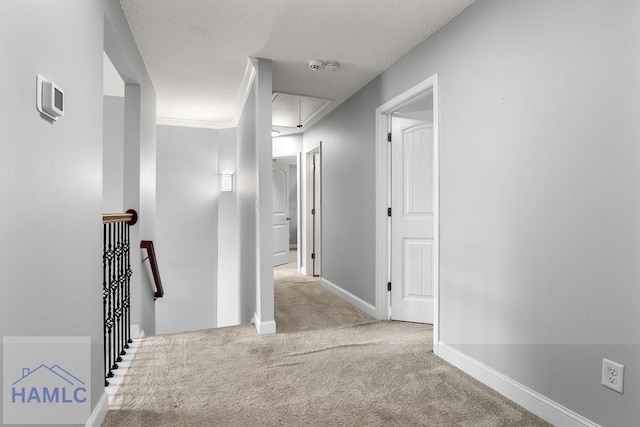 42 Kinlock Ct, Midway, GA 31320 - hall with attic access, an upstairs landing, and carpet