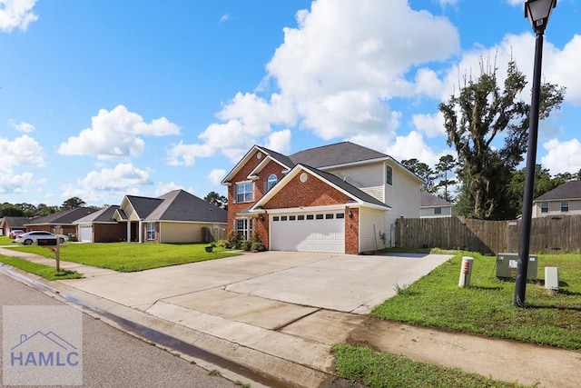 42 Kinlock Ct, Midway, GA 31320 - traditional-style house featuring brick siding, an attached garage, concrete driveway, and a residential view