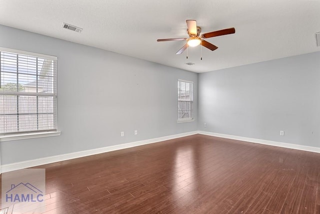 42 Kinlock Ct, Midway, GA 31320 - empty room with ceiling fan and dark wood-type flooring