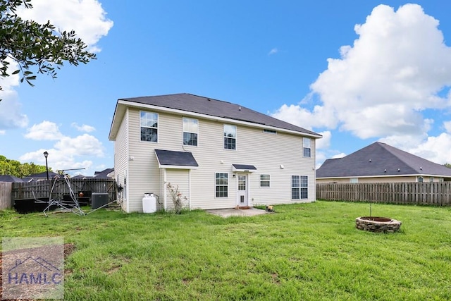42 Kinlock Ct, Midway, GA 31320 - rear view of house with a fenced backyard and a fire pit