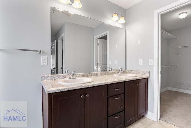 42 Kinlock Ct, Midway, GA 31320 - bathroom with double vanity and a walk in closet