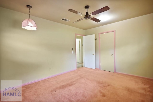 985 Seven Oaks Rd, Jesup, GA 31546 - empty room with a ceiling fan, light colored carpet, and baseboards
