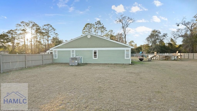 back of property featuring central air condition unit