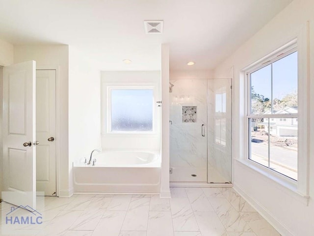 bathroom with shower with separate bathtub