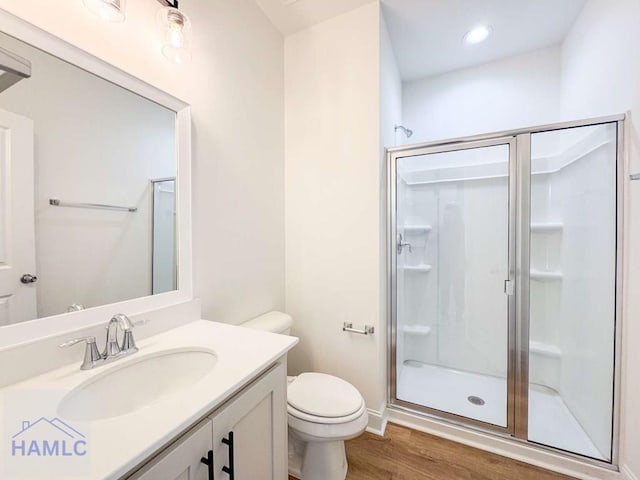 bathroom with toilet and a shower with door