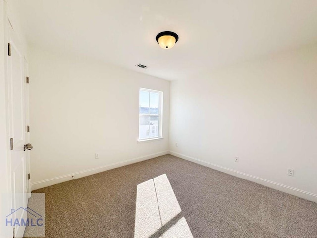 unfurnished room featuring carpet