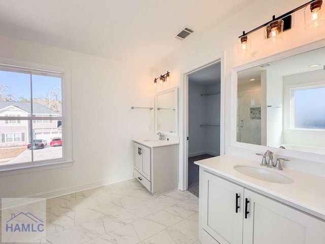 bathroom featuring vanity and an enclosed shower