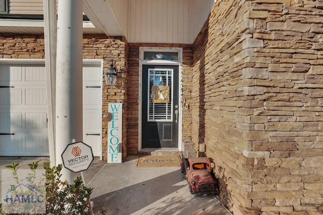 doorway to property with stone siding