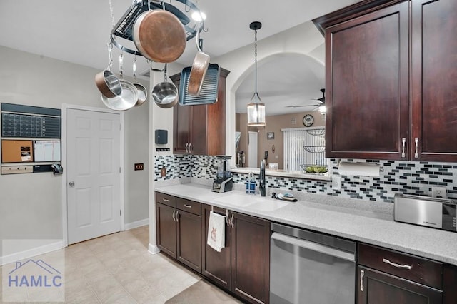 kitchen featuring a sink, light countertops, dark brown cabinets, ceiling fan, and dishwasher