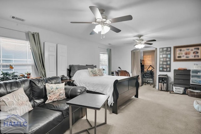 bedroom featuring visible vents, carpet flooring, and ceiling fan