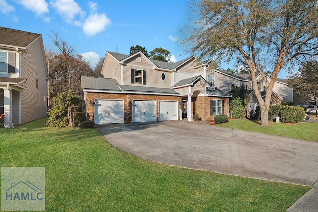 traditional home featuring concrete driveway, a garage, and a front yard