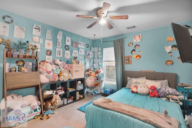 bedroom featuring visible vents, carpet floors, and ceiling fan