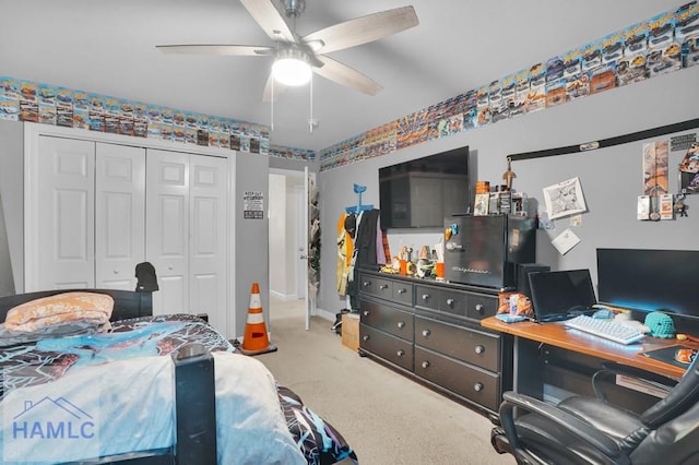 bedroom with a closet, carpet, and ceiling fan