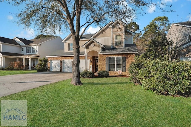 traditional-style house featuring a front yard, an attached garage, and driveway