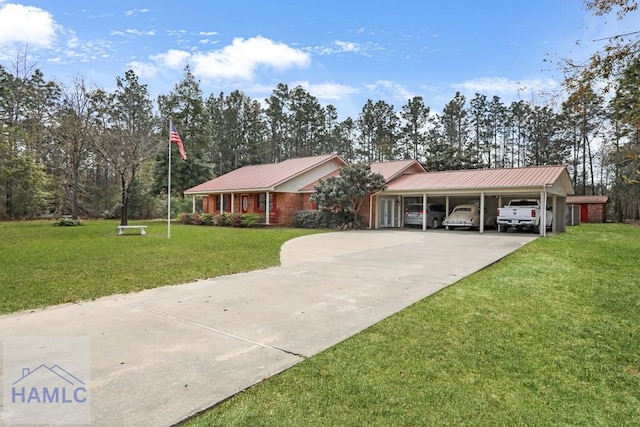 195 Linden Dr, Jesup, GA 31545 - single story home featuring a front yard, concrete driveway, a carport, and metal roof