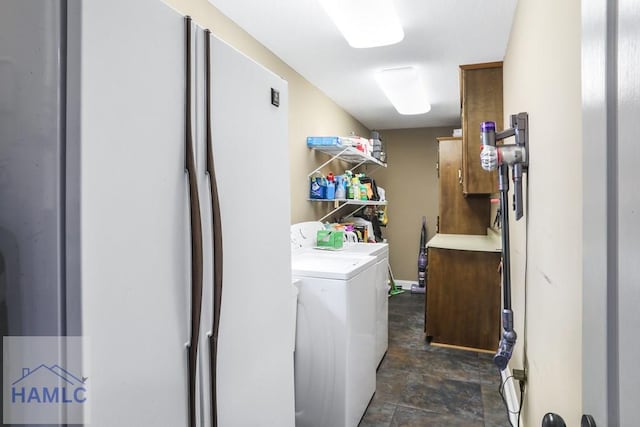 195 Linden Dr, Jesup, GA 31545 - clothes washing area featuring washing machine and clothes dryer, stone finish flooring, and laundry area