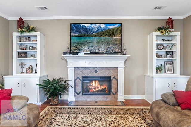 195 Linden Dr, Jesup, GA 31545 - living area with wood finished floors, a tile fireplace, and visible vents