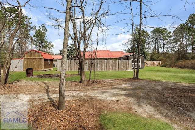195 Linden Dr, Jesup, GA 31545 - view of yard with an outbuilding, fence, and a barn