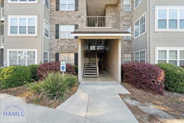 property entrance with brick siding