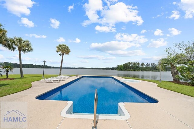 745 Chickasaw Trl, Sparta, GA 31087 - view of pool featuring a patio, a water view, a pool with connected hot tub, and a yard