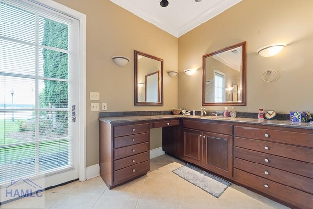 745 Chickasaw Trl, Sparta, GA 31087 - bathroom with healthy amount of natural light, vanity, ornamental molding, tile patterned floors, and baseboards