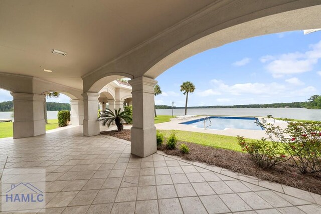 745 Chickasaw Trl, Sparta, GA 31087 - view of patio featuring an outdoor pool and a water view