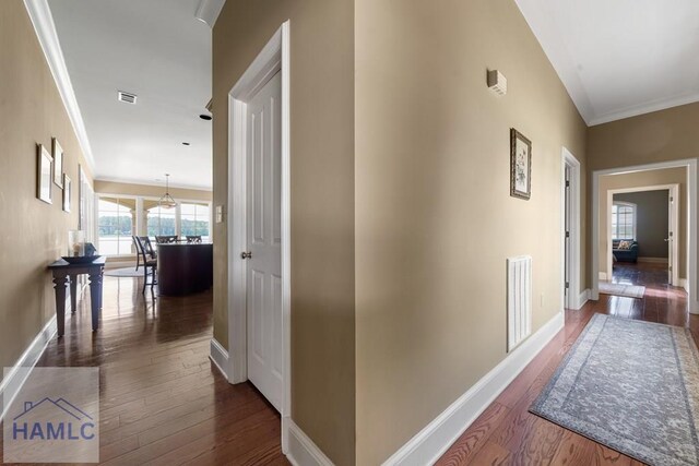 745 Chickasaw Trl, Sparta, GA 31087 - hallway featuring dark wood-style flooring, baseboards, and crown molding