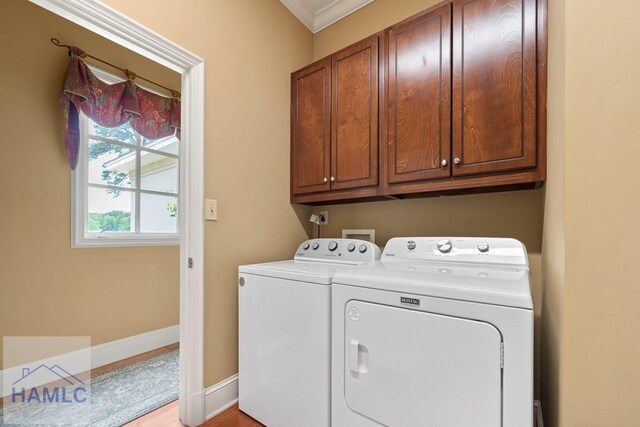 745 Chickasaw Trl, Sparta, GA 31087 - laundry room featuring washing machine and dryer, cabinet space, ornamental molding, and baseboards