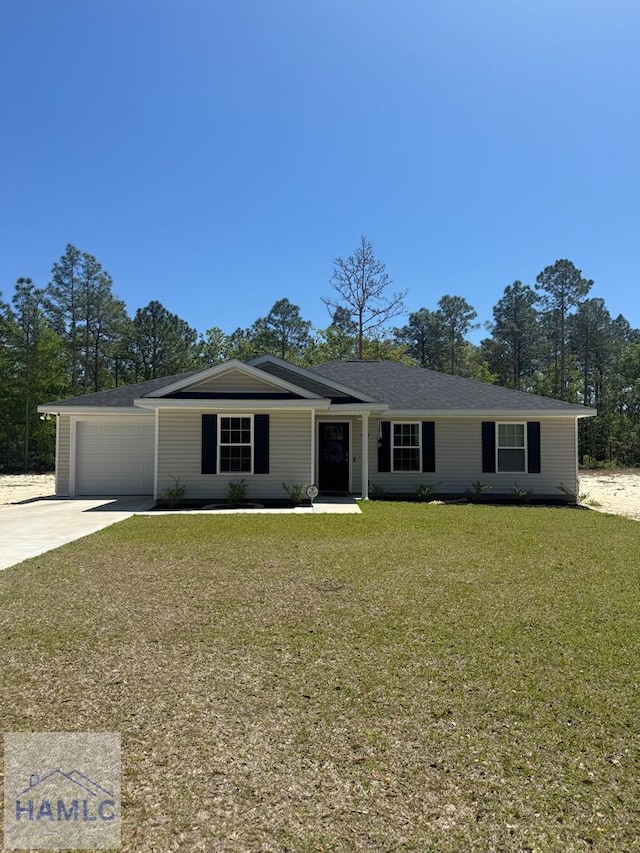 ranch-style home with an attached garage, driveway, and a front yard