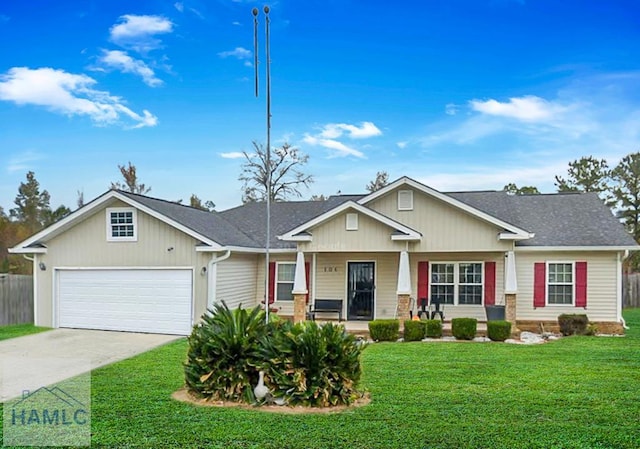 106 White Oak Dr NE, Ludowici, GA 31316 - view of front of home featuring covered porch, a garage, driveway, and roof with shingles