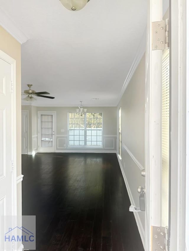 interior space with crown molding and dark hardwood / wood-style floors