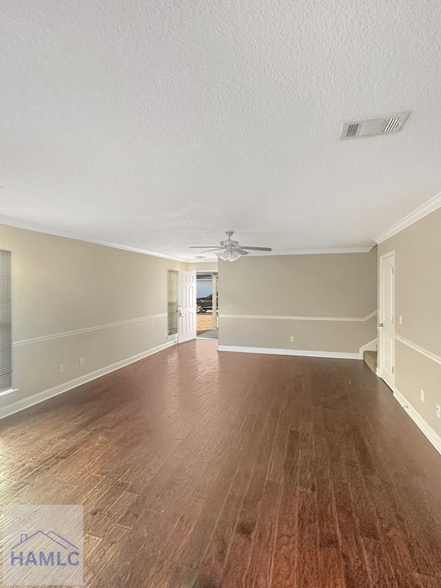 unfurnished living room with crown molding, a textured ceiling, dark wood-type flooring, and ceiling fan