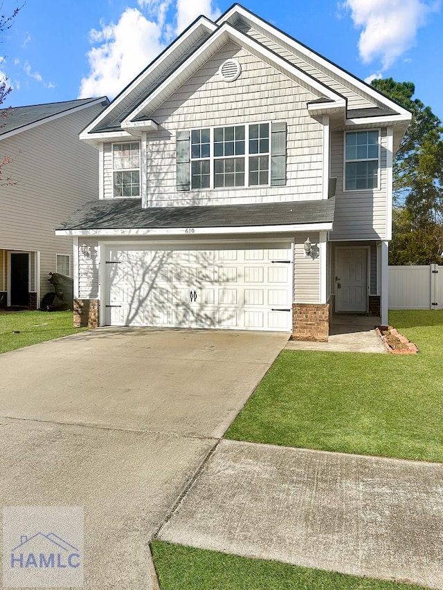 front of property featuring a garage and a front yard