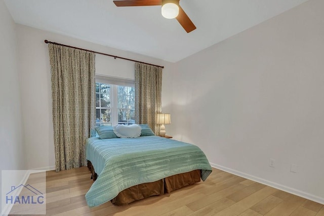 bedroom featuring light hardwood / wood-style flooring and ceiling fan