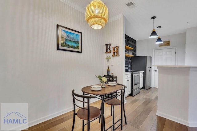 dining room featuring light hardwood / wood-style flooring