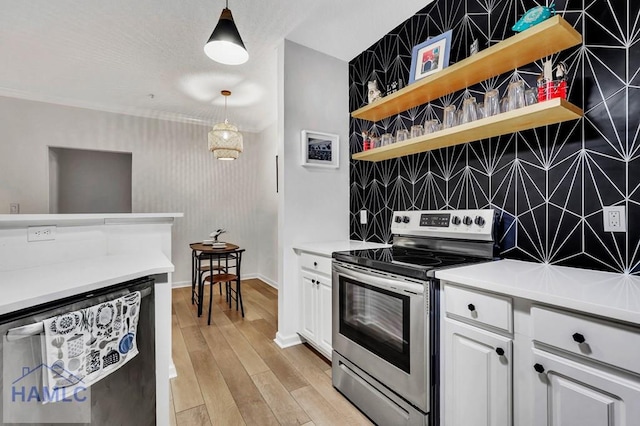 kitchen with hanging light fixtures, white cabinetry, dishwasher, and electric range