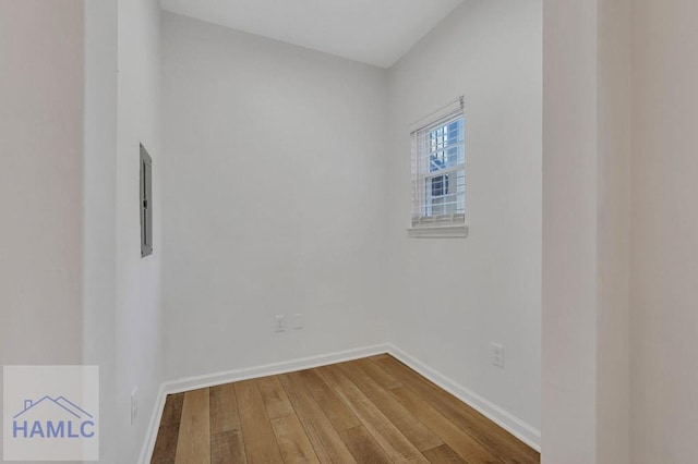 empty room with hardwood / wood-style floors