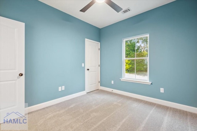 unfurnished room with carpet floors and ceiling fan