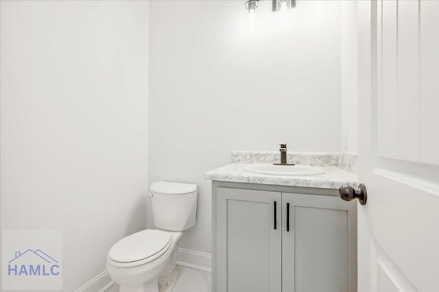 bathroom featuring vanity and toilet